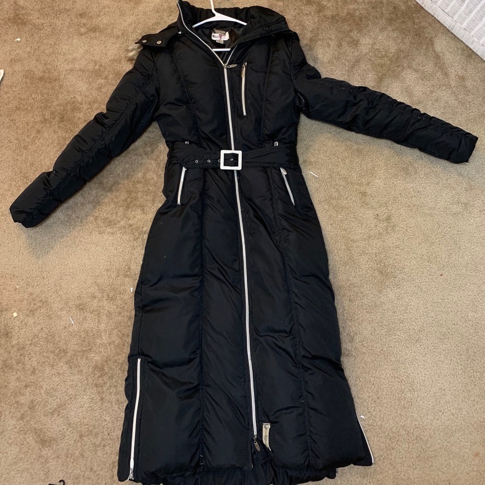 Mecca Femme  full body, long black down coat.